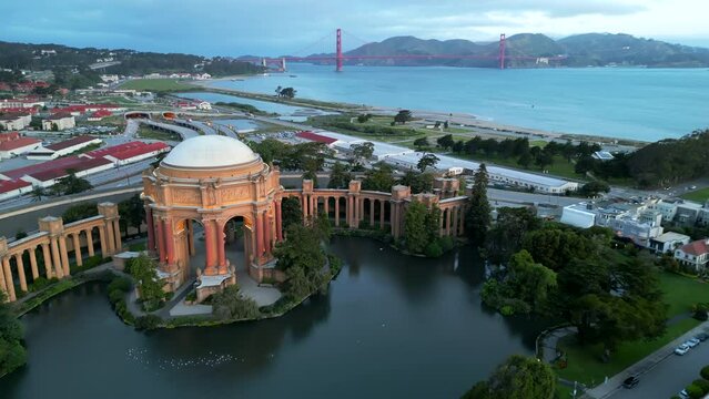 San Francisco, CA, USA. Flying out of the Palace of Fine Arts and Golden Gate Bridge in the cloudy morning. High quality 4k footage