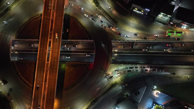 Expressway top view, Road traffic an important infrastructure, car traffic transportation above intersection road in city night sky aerial view cityscape of advanced innovation, financial technology