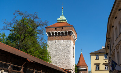 St. Florian's Gate or Florian Gate, Brama Floriańska Kraków. Gothic tower in Krakow, Poland. Part of historic fortifications in the Old Town of Cracow. - obrazy, fototapety, plakaty