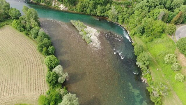 A panorama of rural nature juxtaposed with an urban centre, from the ground up
