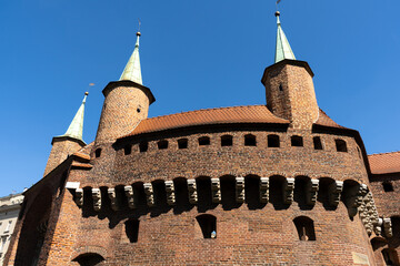 Kraków Barbican on Basztowa Street in Krakow, Poland. Barbakan Krakowski monument. Historic...