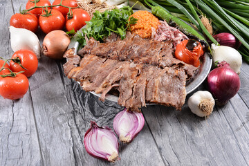 Meat Doner with pita, Bulgur pilaf, onion and grilled vegetables