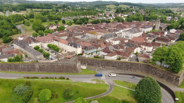Drone view that looks from the city to its bridge and stream