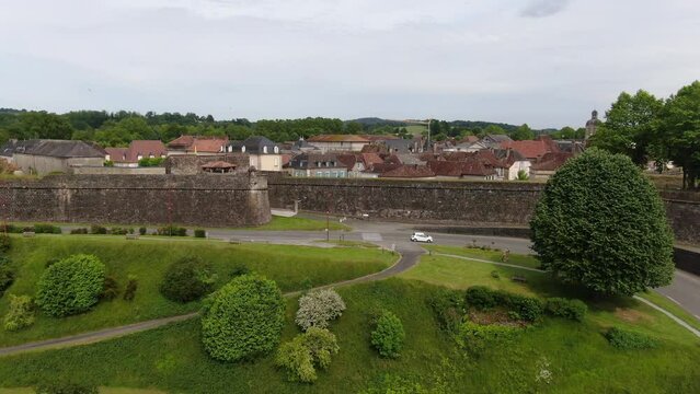 Aerial sequence that goes from the top overlooking the ancestral village down with the aquatic shore and drone just above the water