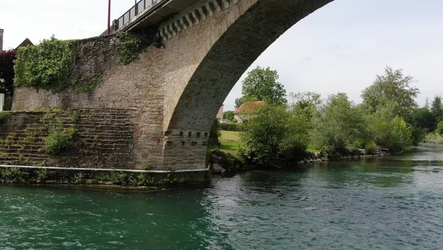 View of a drone passing under a bridge