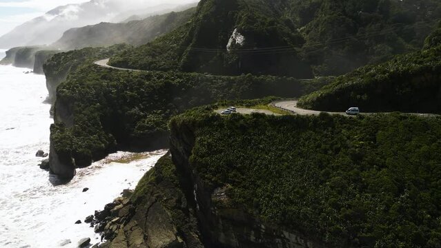 Iconic coastal hillside road of New Zealand Westcoast, aerial view