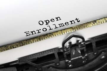 Text Open enrollment typed on typewriter