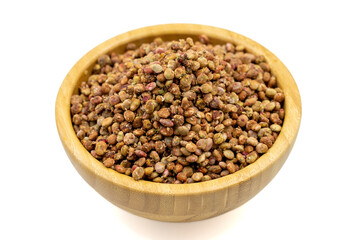 Sumac seeds. Dried sumac berries isolated on white background. Spice concept. Close up