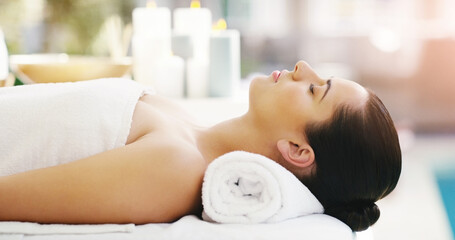 Obraz na płótnie Canvas Woman, relax and sleeping on massage bed at spa for zen, physical therapy or healthy wellness at resort. Calm female person relaxing in peaceful sleep for luxury body treatment or self love at salon