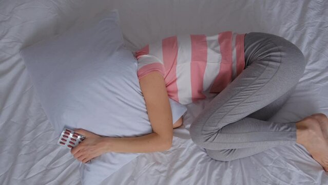Woman feels anxiety and symptom of depression while lying in bed. Mental health