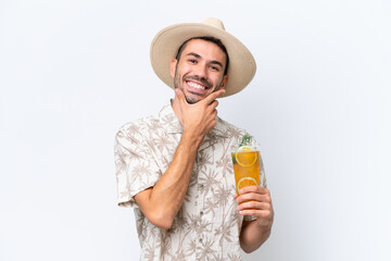 Young caucasian man holding a cocktail isolated on white background happy and smiling