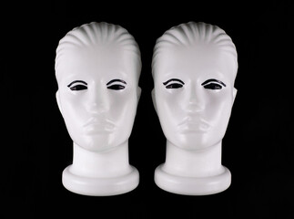 white mannequin head on black background