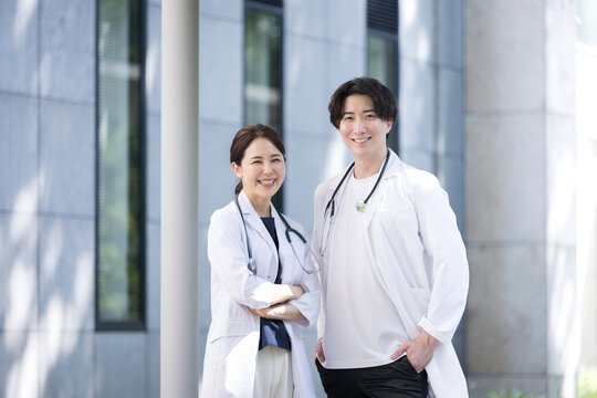 For recruitment or career change Image of fresh young Asian men and women residents, doctors, and researchers looking at the camera