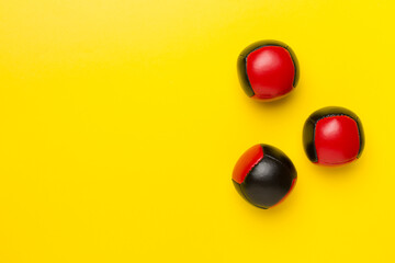 Colorful juggling ball on color background, top view