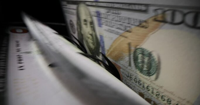 Dollar bill on banknote counter in financial institution. Banknote counters and sorters