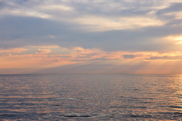 Clouds above sea during sunset