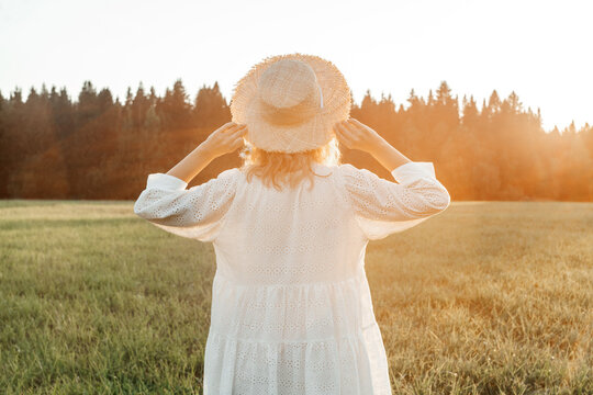 Portrait Of A Blonde Woman In Field.