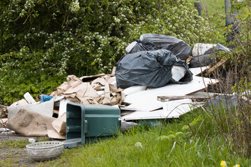 Naughty Illegal Rubbish being dumped on countryside roads in the United Kingdom, which has adverse...