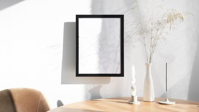 Video black photo frame mockup with beige vase and wooden table on wall