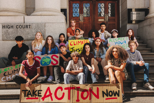 Group of multicultural teenagers protesting against climate change