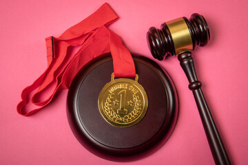 Dispute, law and court judgment concept. Gold medal and gavel