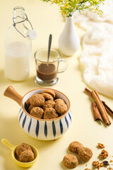 cookies in bowl, choco milk in glass  on the table