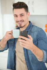 young man with a coffee happy expression