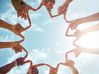 Peace, star and hands of friends on blue sky background with support, collaboration and solidarity. V sign, fingers shape of people outdoor for community, goal and social happiness, voice or union