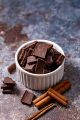 Chocolate pieces in a ceramic container and an ice cream maker