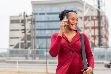 beautiful young black lady making a phone call
