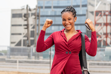 beautiful young african lady feeling happy and celebrates