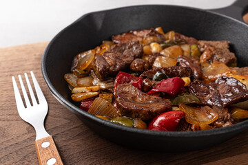 Steak Bites with small pieces of beef and vegetables stir-fried in steak sauce