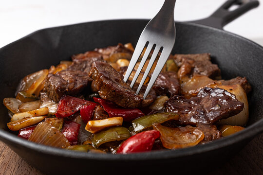 Steak Bites with small pieces of beef and vegetables stir-fried in steak sauce