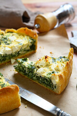 Sliced kale spinach feta pie on a napkin