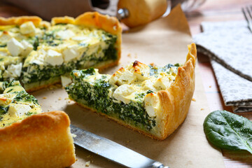 Piece of delicious spinach cheesequiche pie