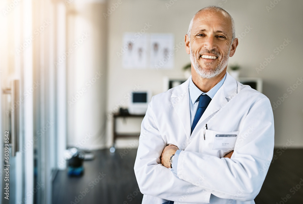 Wall mural mature doctor, clinic and portrait with arms crossed in hospital feeling proud from medical work. he