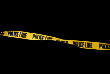 Do not cross police line tape yellow isolated on black background. This has clipping path.