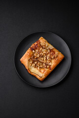 Delicious fresh sweet pie or pizza with pear, brie cheese, honey and nuts