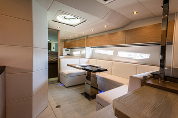 Interior of a modern yacht, living room with sofa and bed - 604002515