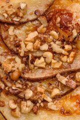 Delicious fresh sweet pie or pizza with pear, brie cheese, honey and nuts