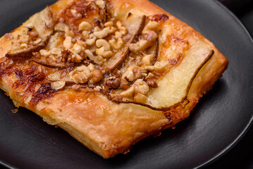 Delicious fresh sweet pie or pizza with pear, brie cheese, honey and nuts