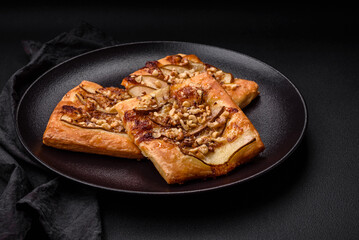 Delicious fresh sweet pie or pizza with pear, brie cheese, honey and nuts