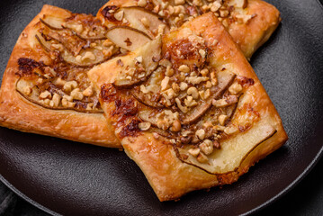 Delicious fresh sweet pie or pizza with pear, brie cheese, honey and nuts