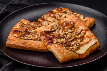 Delicious fresh sweet pie or pizza with pear, brie cheese, honey and nuts