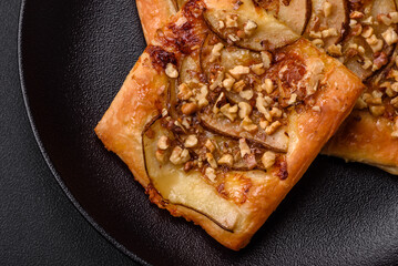 Delicious fresh sweet pie or pizza with pear, brie cheese, honey and nuts