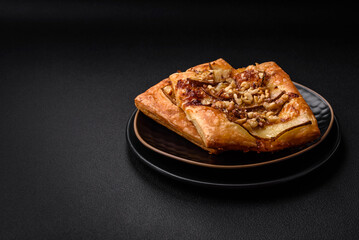 Delicious fresh sweet pie or pizza with pear, brie cheese, honey and nuts
