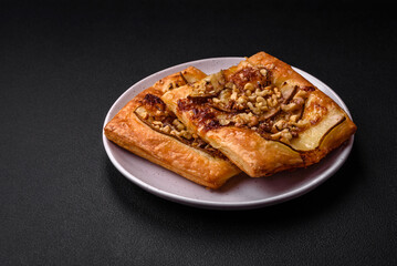 Delicious fresh sweet pie or pizza with pear, brie cheese, honey and nuts