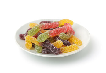 Colorful chewy jelly worms in white ceramic plate