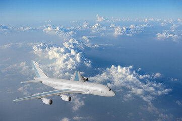 Naklejka na ściany i meble airplane in the clouds