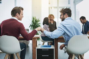 Friends, collaboration and fist bump with business people in their office, working together on a company project. Motivation, teamwork and congratulations with colleagues celebrating success at work
